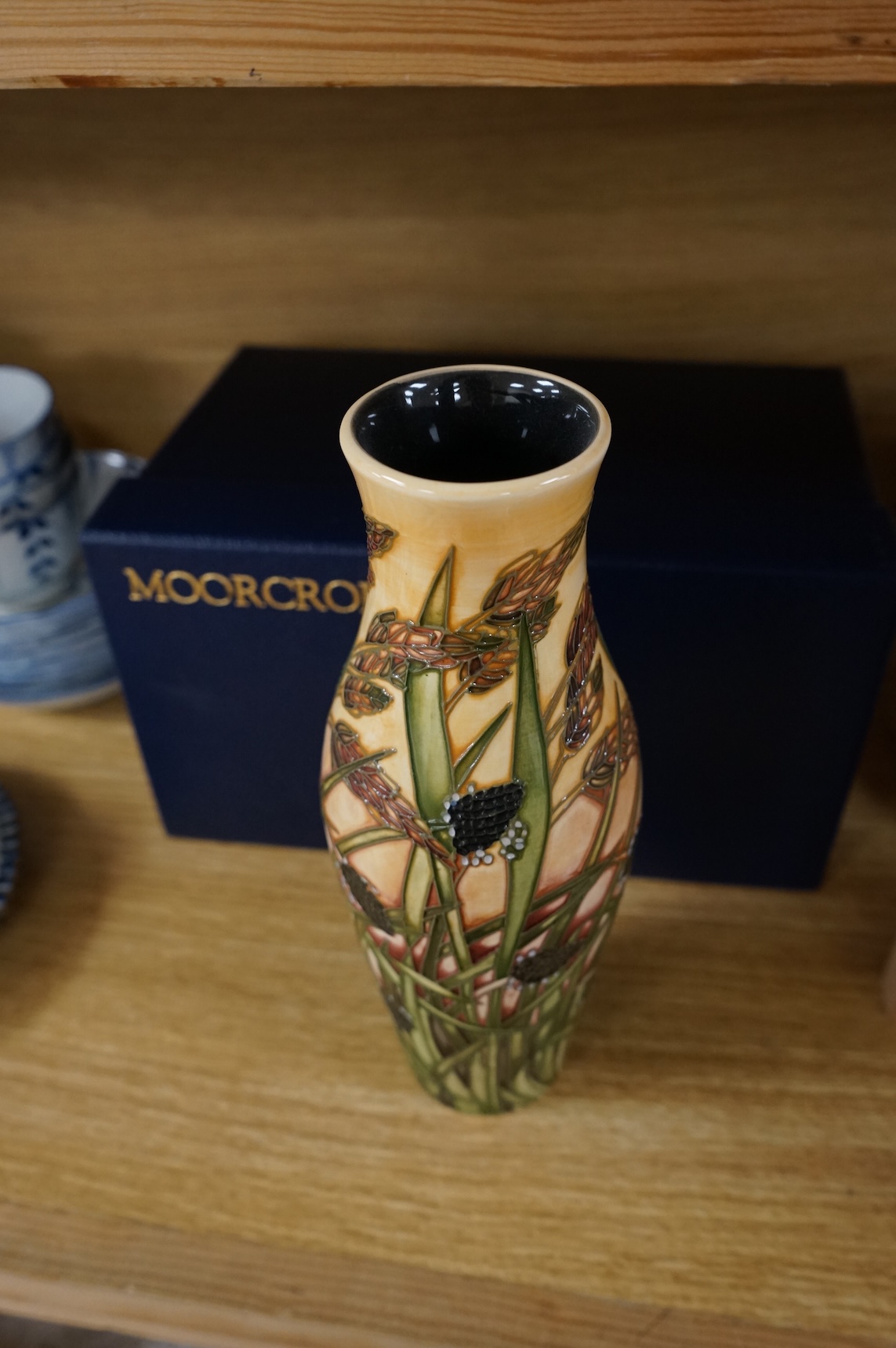 A boxed Moorcroft limited edition Savannah vase by Emma Bossons, 259/500, signed and dated 2001, 25cm